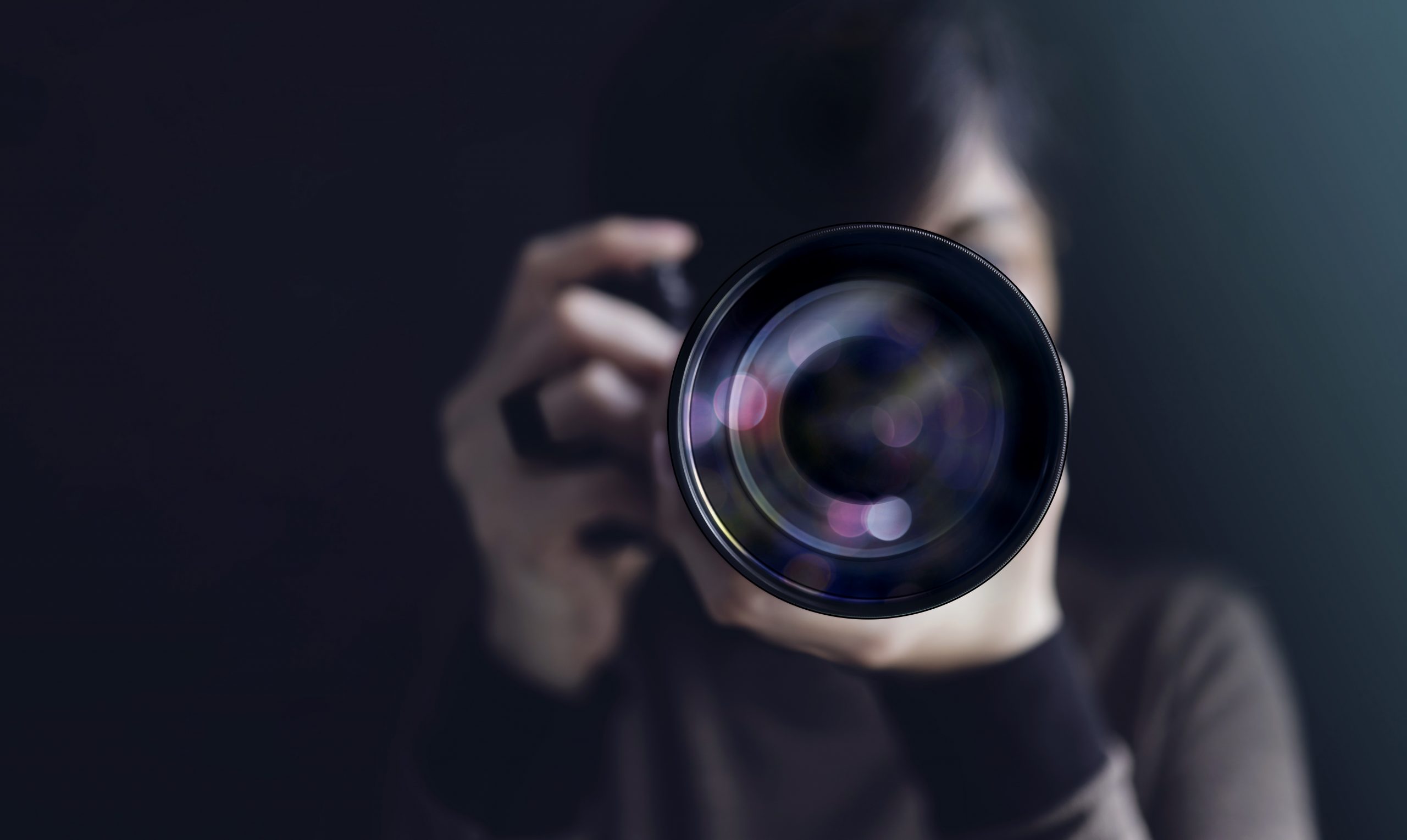 Photographer Taking Self-Portrait. Woman using Camera to Taking